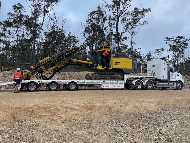 Beards Drilling’s Atlas drill rig being offloaded from a truck. This drilling equipment for Construction and Mining is the best and can tackle any drilling job with ease.